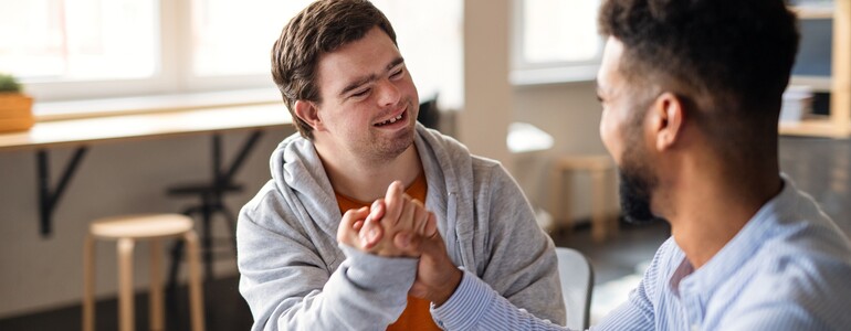 Young,Happy,Man,With,Down,Syndrome,With,His,Mentoring,Friend